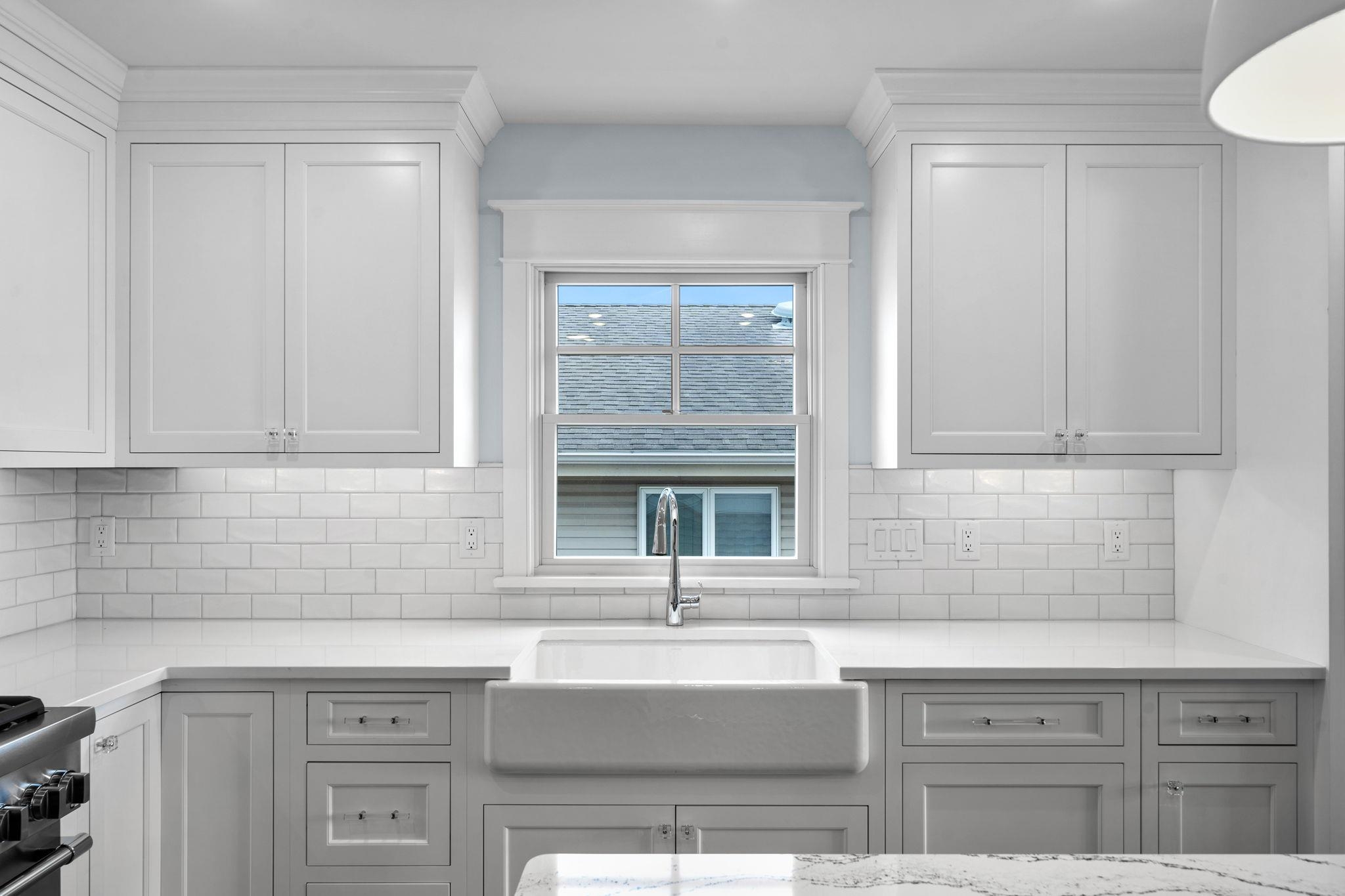 249 35th Street, Unit EAST SIDE Avalon, NJ 08202 - Photo 8 of 45 a kitchen with granite countertop a sink and cabinets