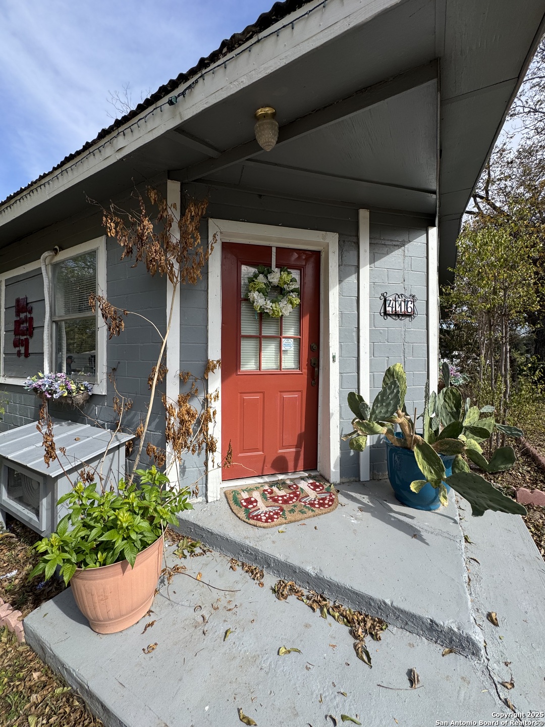 416 16th Street Hondo, TX 78861 - Photo 2 of 6 a front view of a house with a potted plant