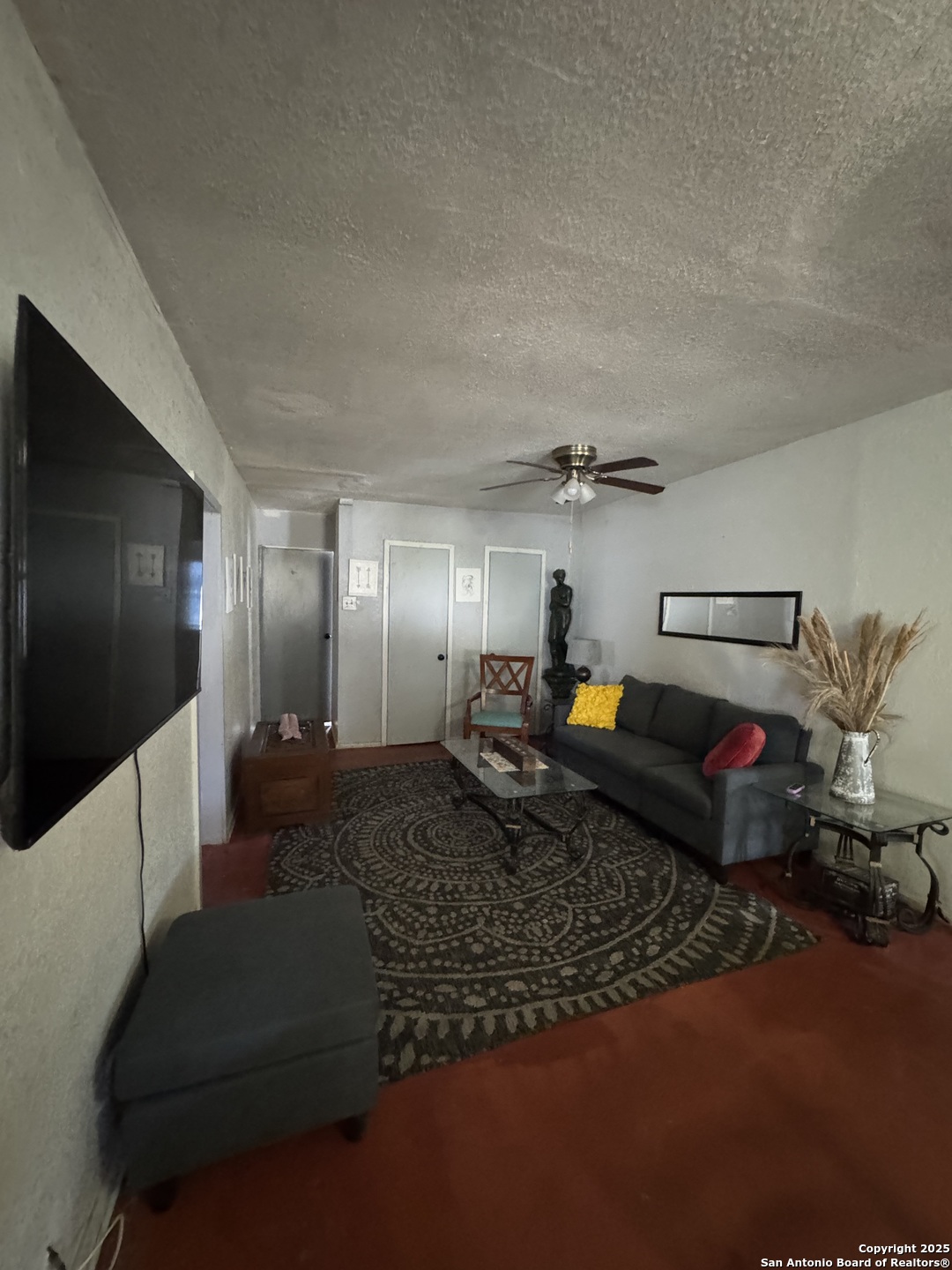 416 16th Street Hondo, TX 78861 - Photo 3 of 6 a living room with furniture and a flat screen tv