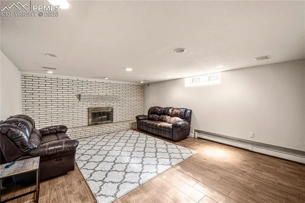 a living room with furniture and a fireplace