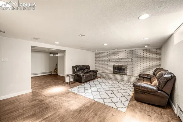 a living room with furniture and a fireplace