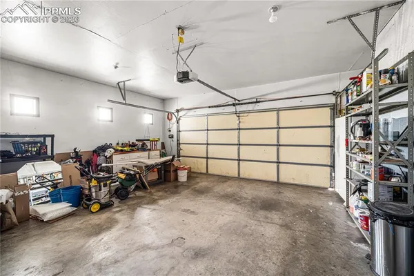 a view of a garage with rack and bicycle