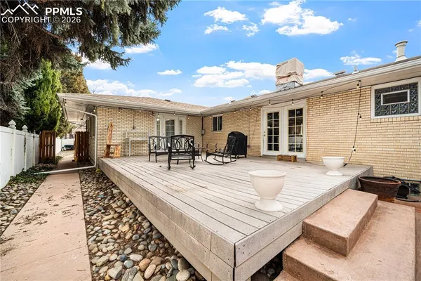a view of a dinning table and chairs in the patio
