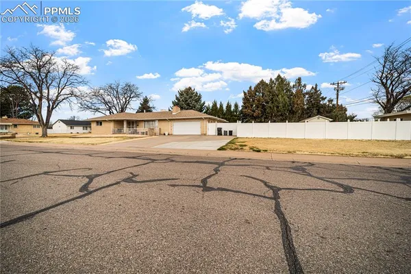 a view of a yard with swimming pool