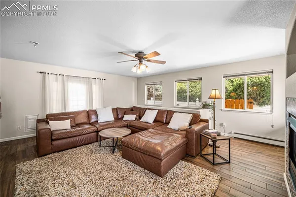 a living room with furniture and a window