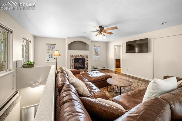 a living room with furniture and a fireplace