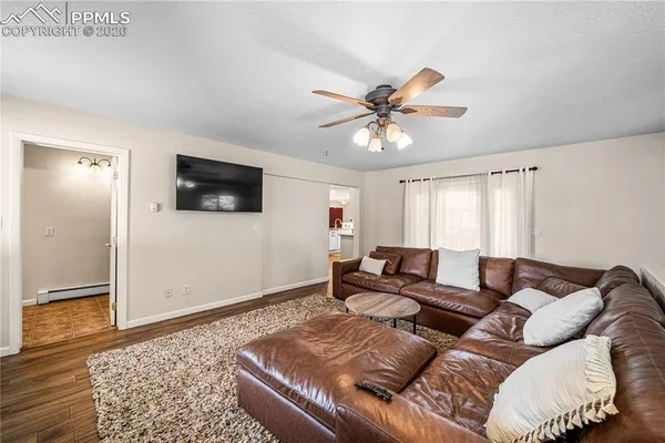 a kitchen with stainless steel appliances granite countertop a stove top oven a sink dishwasher and a refrigerator