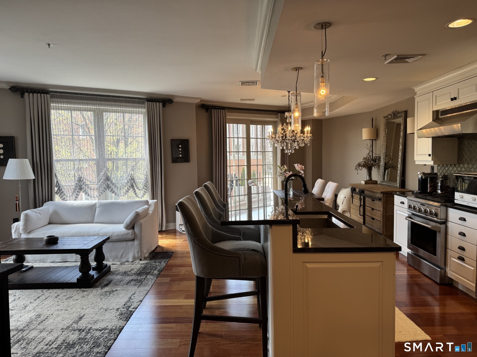 85 Memorial Road, Unit 201 West Hartford, CT 06107 - Photo 12 of 36 a view of a livingroom with furniture and a window