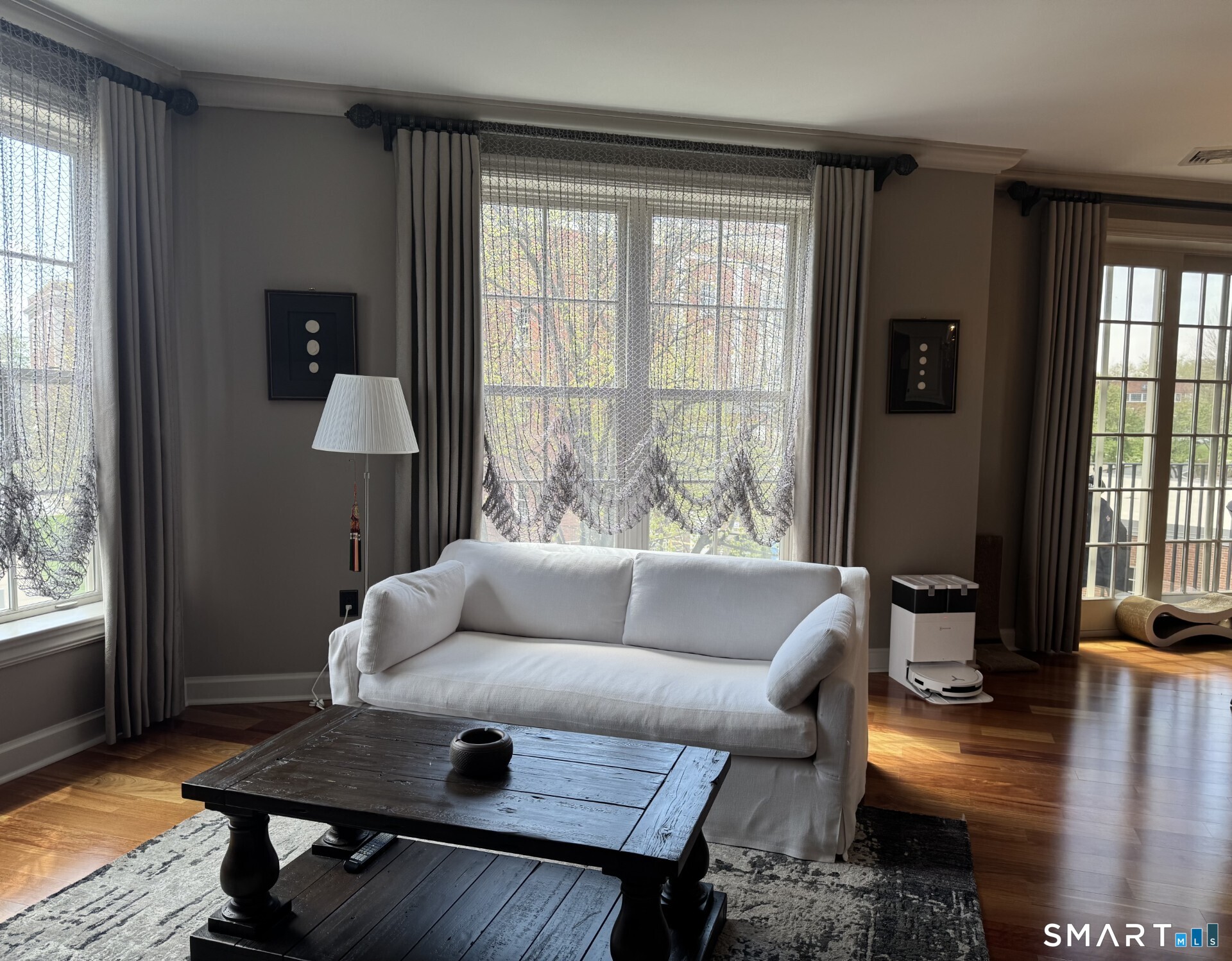 85 Memorial Road, Unit 201 West Hartford, CT 06107 - Photo 19 of 36 a living room with furniture and a window