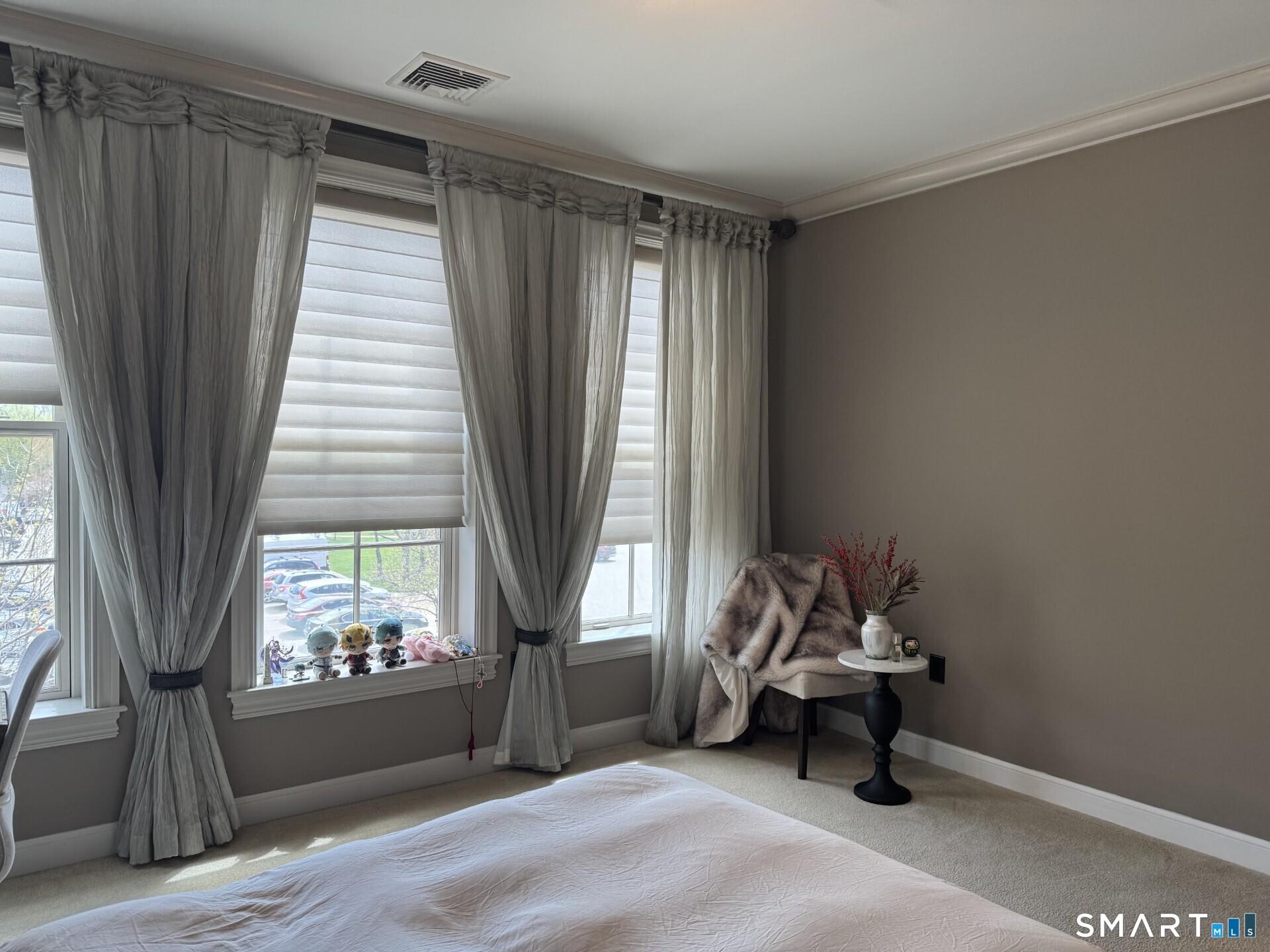 85 Memorial Road, Unit 201 West Hartford, CT 06107 - Photo 22 of 36 a living room with furniture and a window