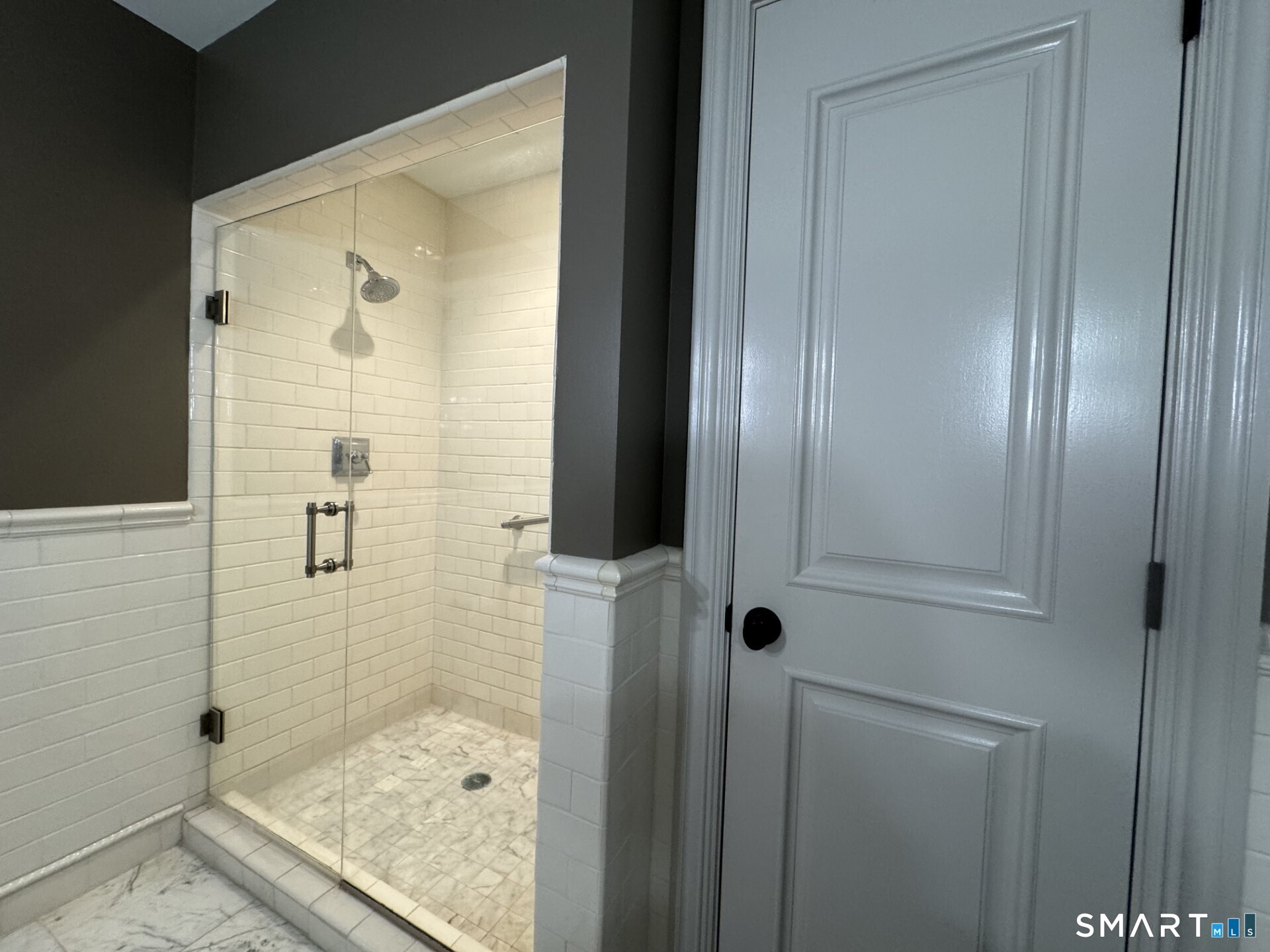 85 Memorial Road, Unit 201 West Hartford, CT 06107 - Photo 25 of 36 a bathroom with a glass shower door