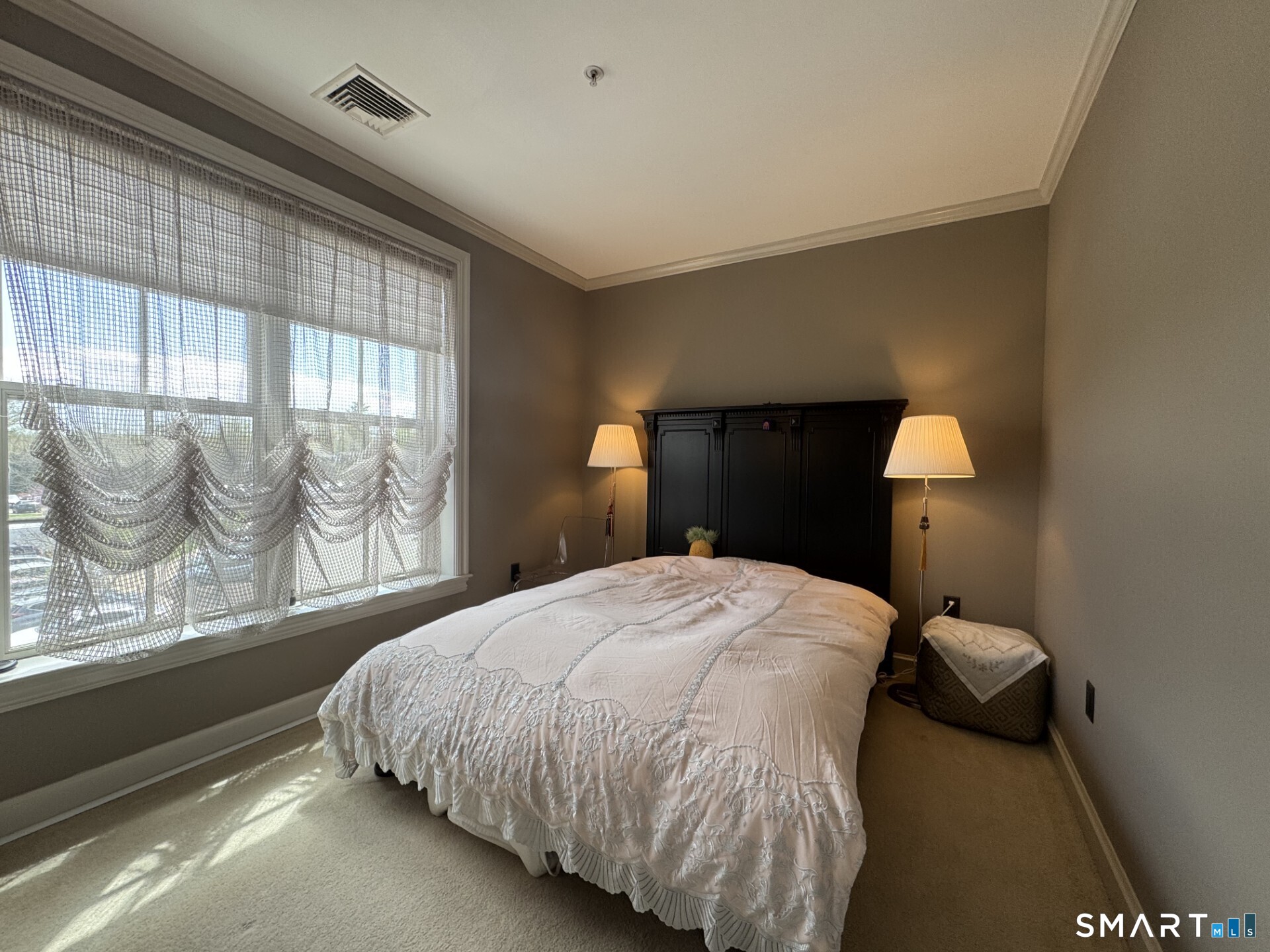85 Memorial Road, Unit 201 West Hartford, CT 06107 - Photo 26 of 36 a bedroom with a bed and window