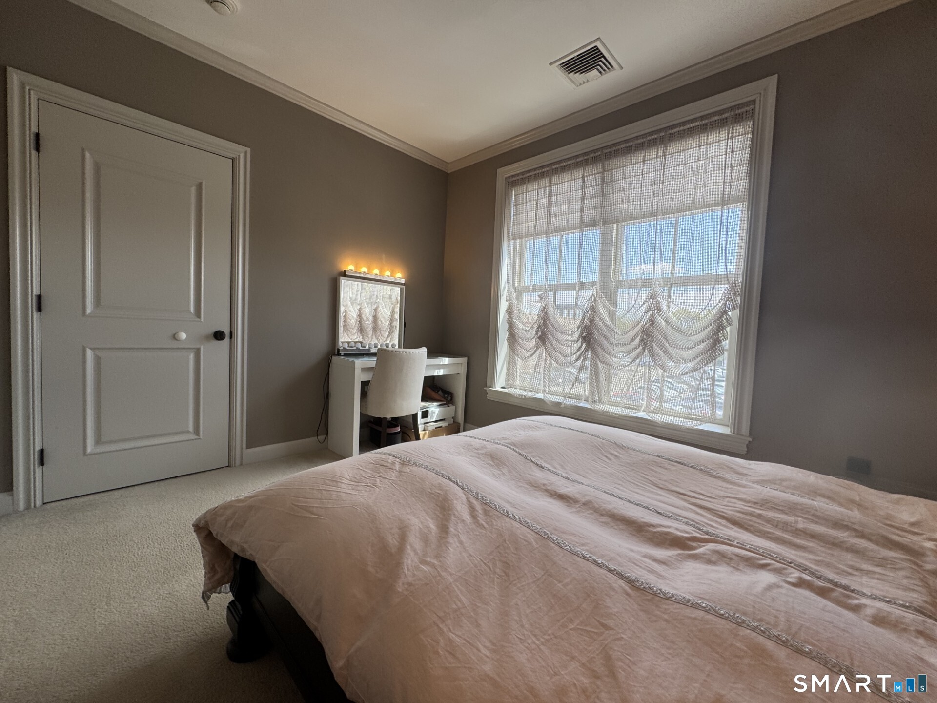 85 Memorial Road, Unit 201 West Hartford, CT 06107 - Photo 27 of 36 a spacious bedroom with a large bed and a dresser