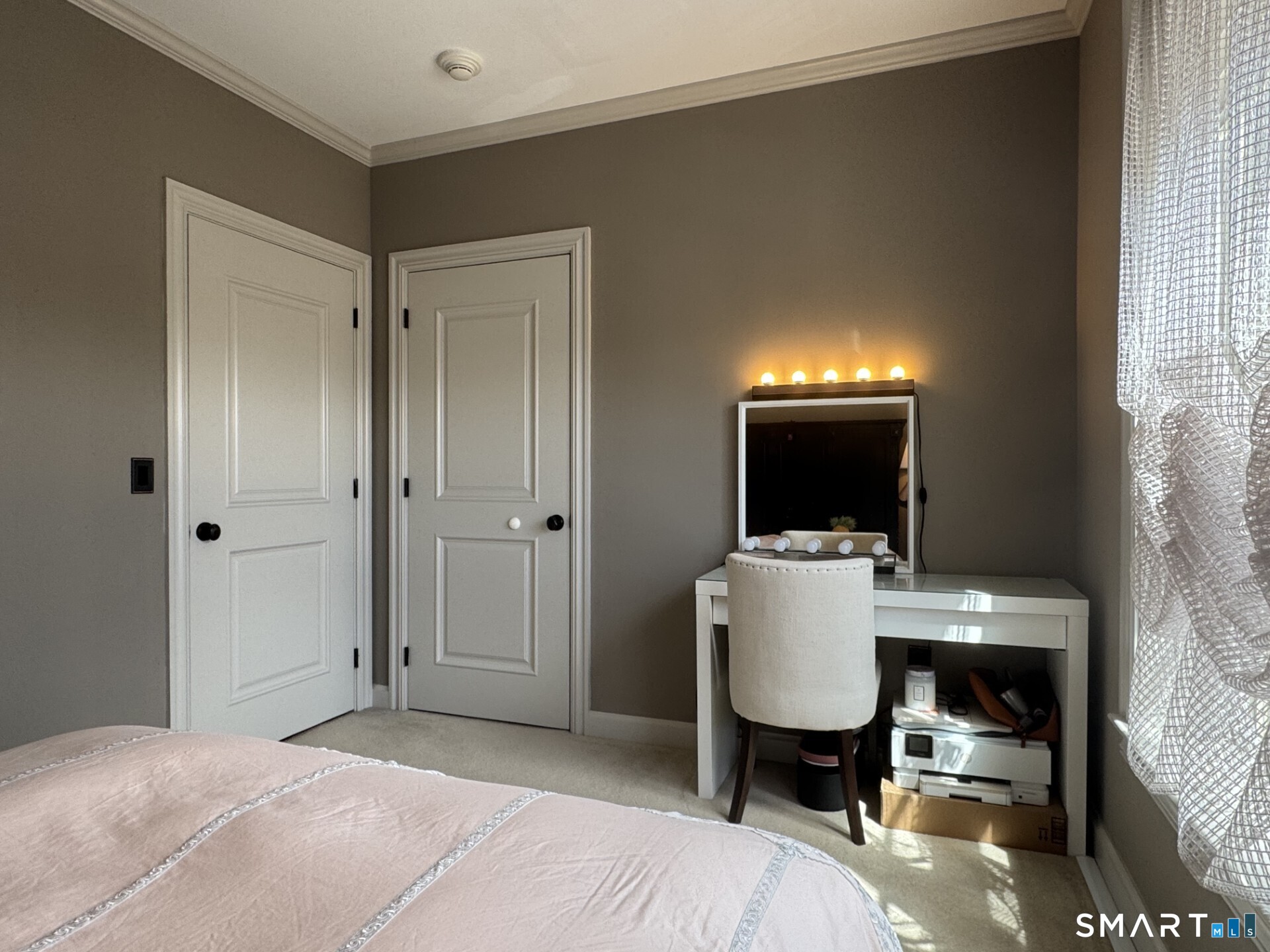 85 Memorial Road, Unit 201 West Hartford, CT 06107 - Photo 28 of 36 a room with a bed and a chair in it