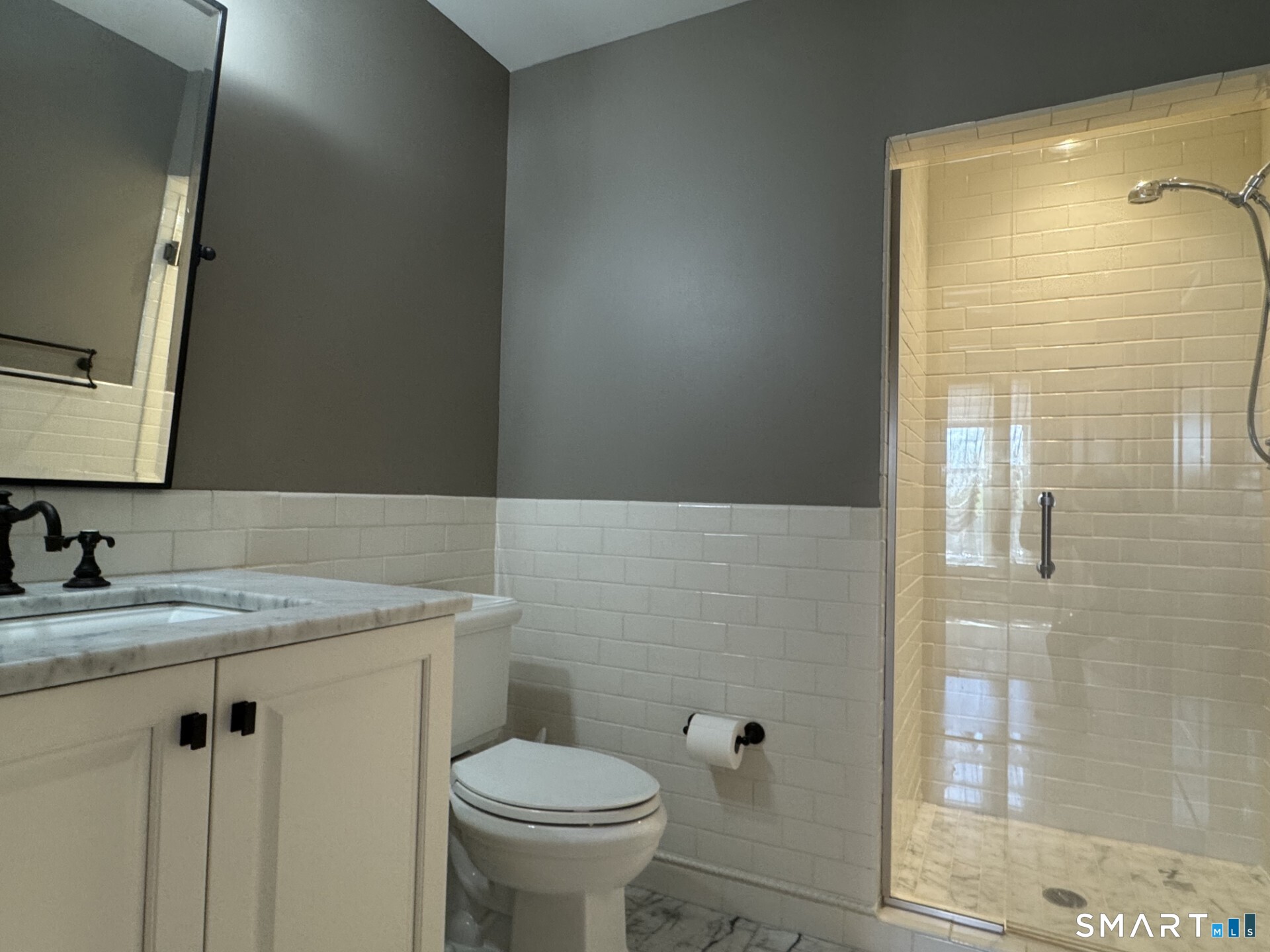 85 Memorial Road, Unit 201 West Hartford, CT 06107 - Photo 29 of 36 a bathroom with a granite countertop sink toilet and shower