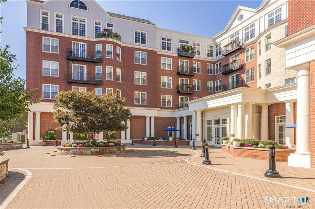 85 Memorial Road, Unit 201 West Hartford, CT 06107 - Photo 3 of 36 a view of a building with a street