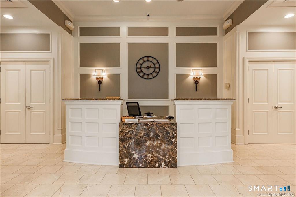 85 Memorial Road, Unit 201 West Hartford, CT 06107 - Photo 5 of 36 a living room with furniture and a table