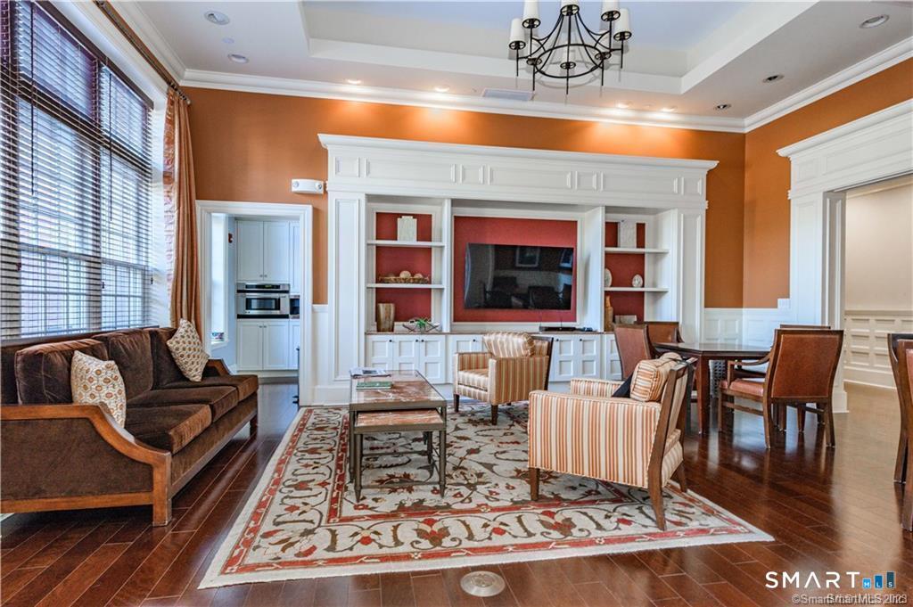 85 Memorial Road, Unit 201 West Hartford, CT 06107 - Photo 8 of 36 a living room with furniture and a rug