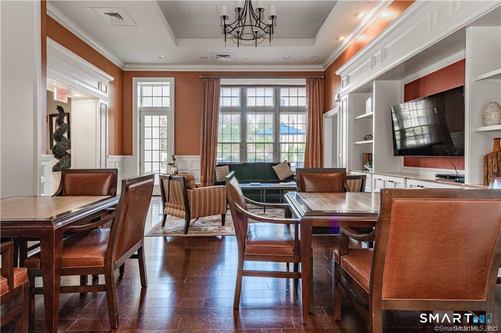 85 Memorial Road, Unit 201 West Hartford, CT 06107 - Photo 9 of 36 a view of a dining room with furniture window and outside view