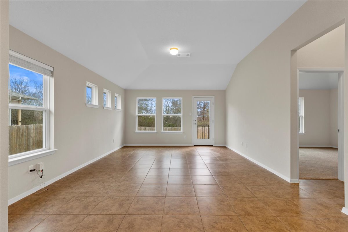 123 Saranac Drive Elgin, TX 78621 - Photo 12 of 26 a view of an empty room with a window
