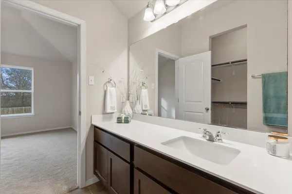 a bathroom with a double vanity sink and mirror