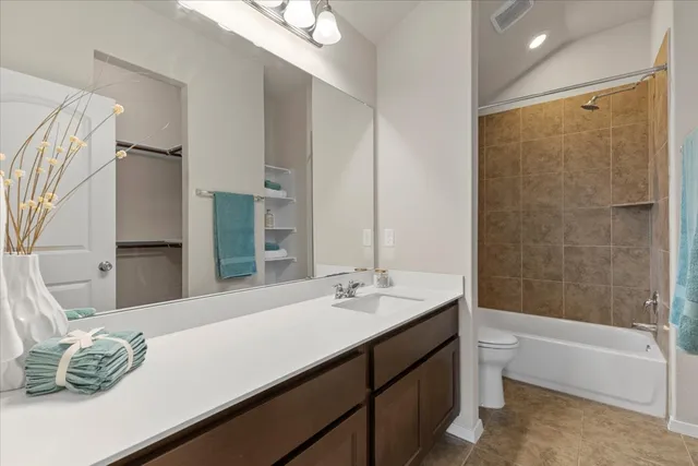 a bathroom with a double vanity sink and a bathtub