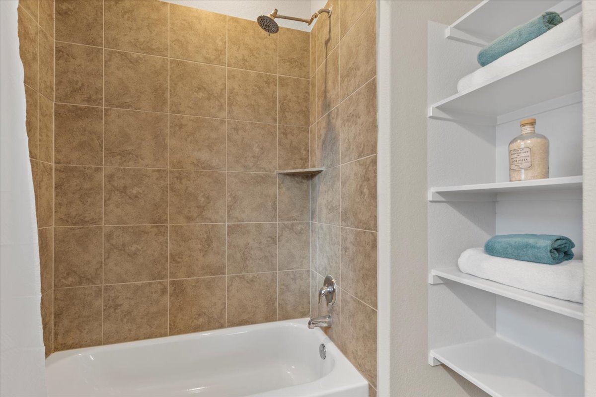 123 Saranac Drive Elgin, TX 78621 - Photo 17 of 26 a bath tub sitting next to a white sink