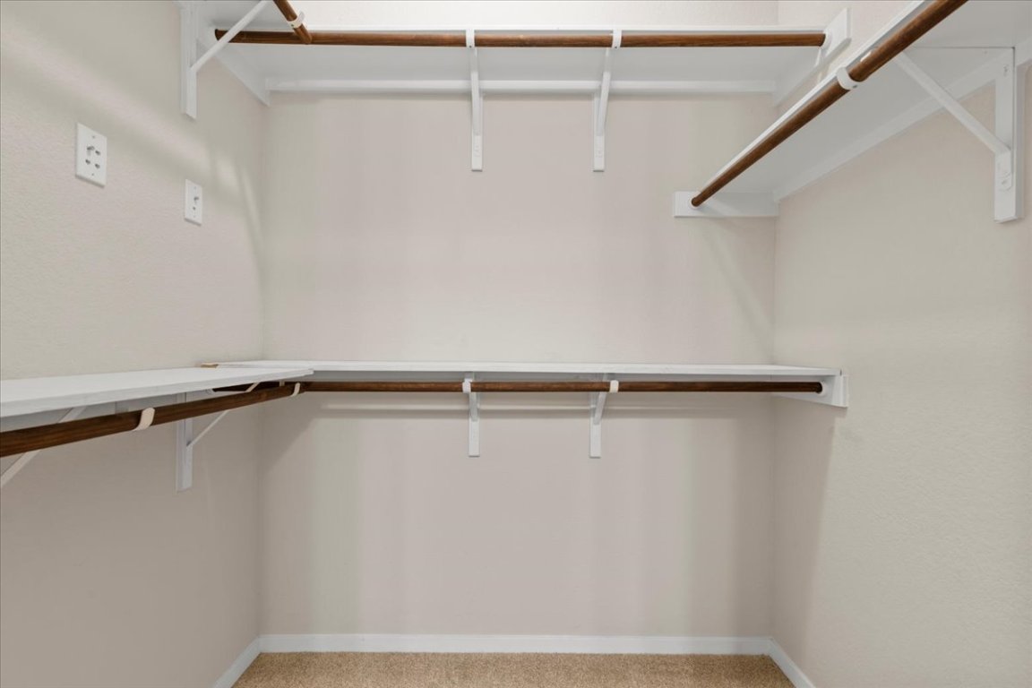 123 Saranac Drive Elgin, TX 78621 - Photo 18 of 26 The walk-in closet provides excellent storage and organization.