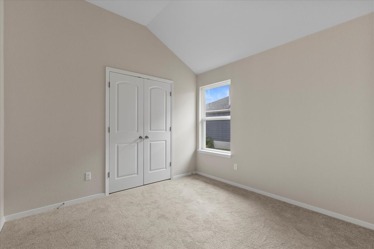 123 Saranac Drive Elgin, TX 78621 - Photo 19 of 26 a view of an empty room with a window
