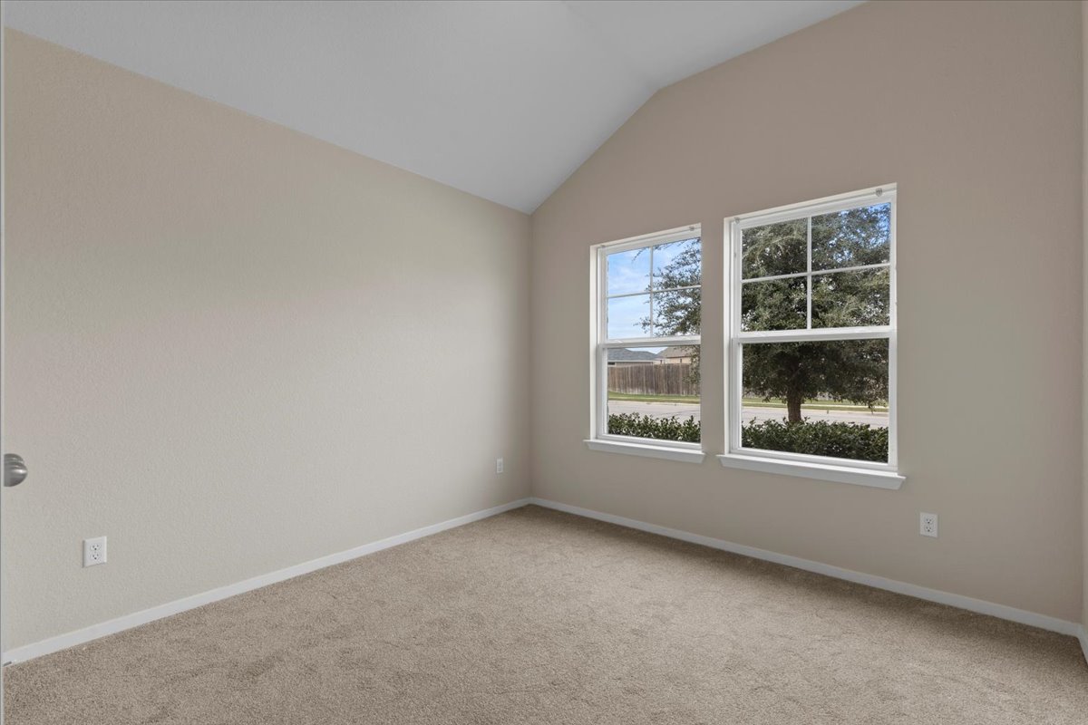 123 Saranac Drive Elgin, TX 78621 - Photo 20 of 26 an empty room with a window