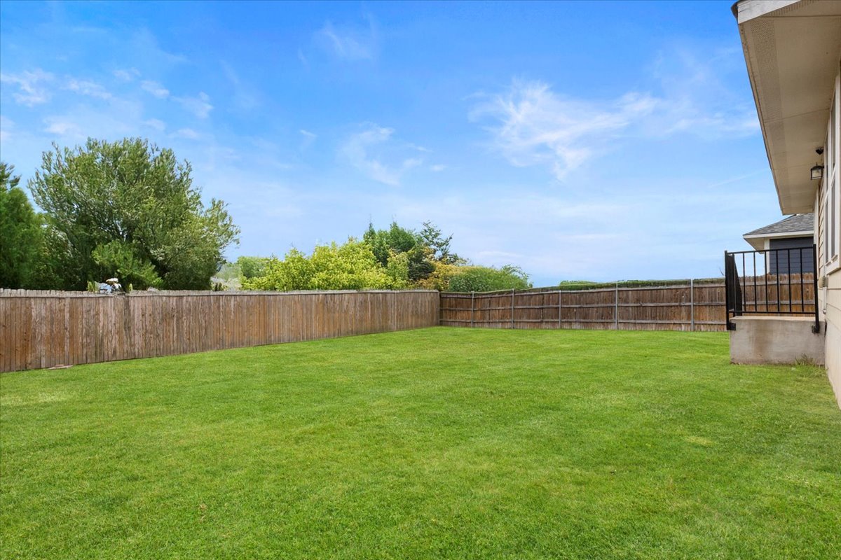 123 Saranac Drive Elgin, TX 78621 - Photo 26 of 26 a view of yard with swimming pool and wooden fence