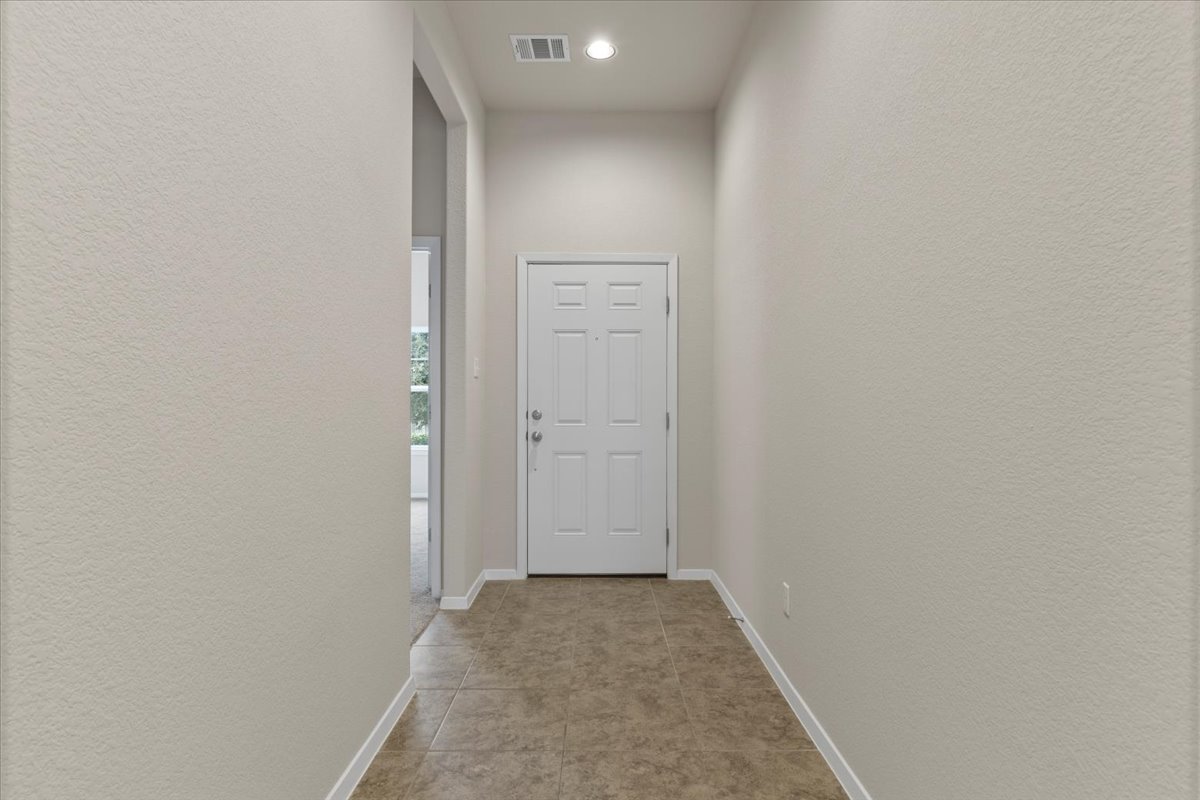 123 Saranac Drive Elgin, TX 78621 - Photo 4 of 26 a view of a hallway