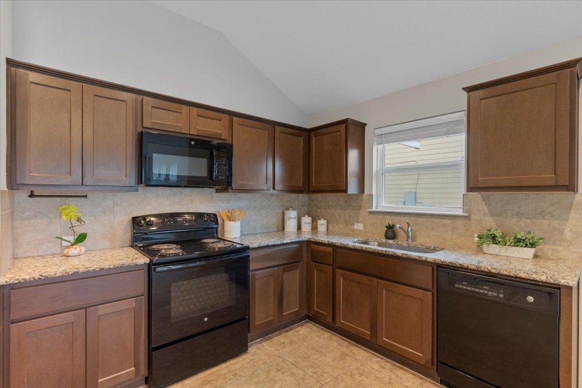 123 Saranac Drive Elgin, TX 78621 - Photo 9 of 26 Plenty of counter space makes meal prep and entertaining effortless.
