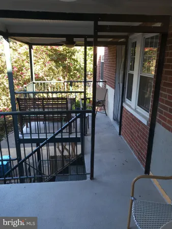 a view of a porch with furniture and floor