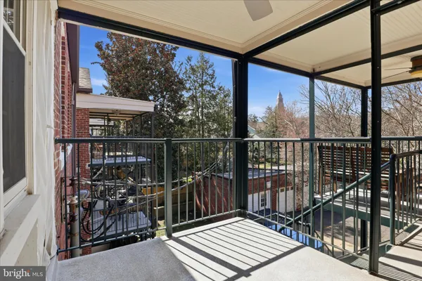 a view of a balcony with wooden floor