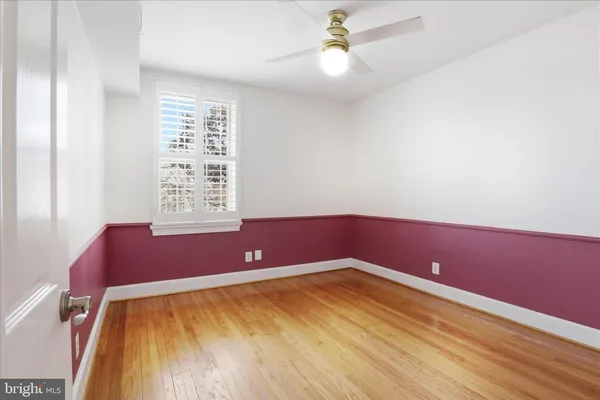 a view of room with window and ceiling fan