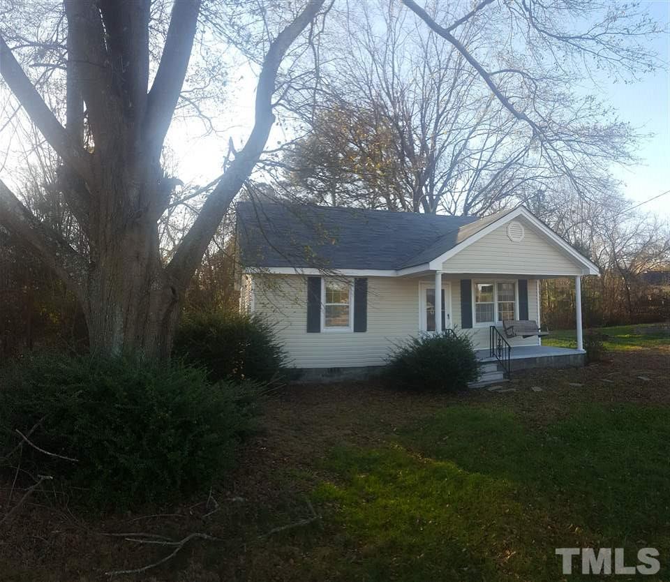 9716 Sauls Road Raleigh, NC 27603 - Photo 1 of 23 a front view of a house with garden