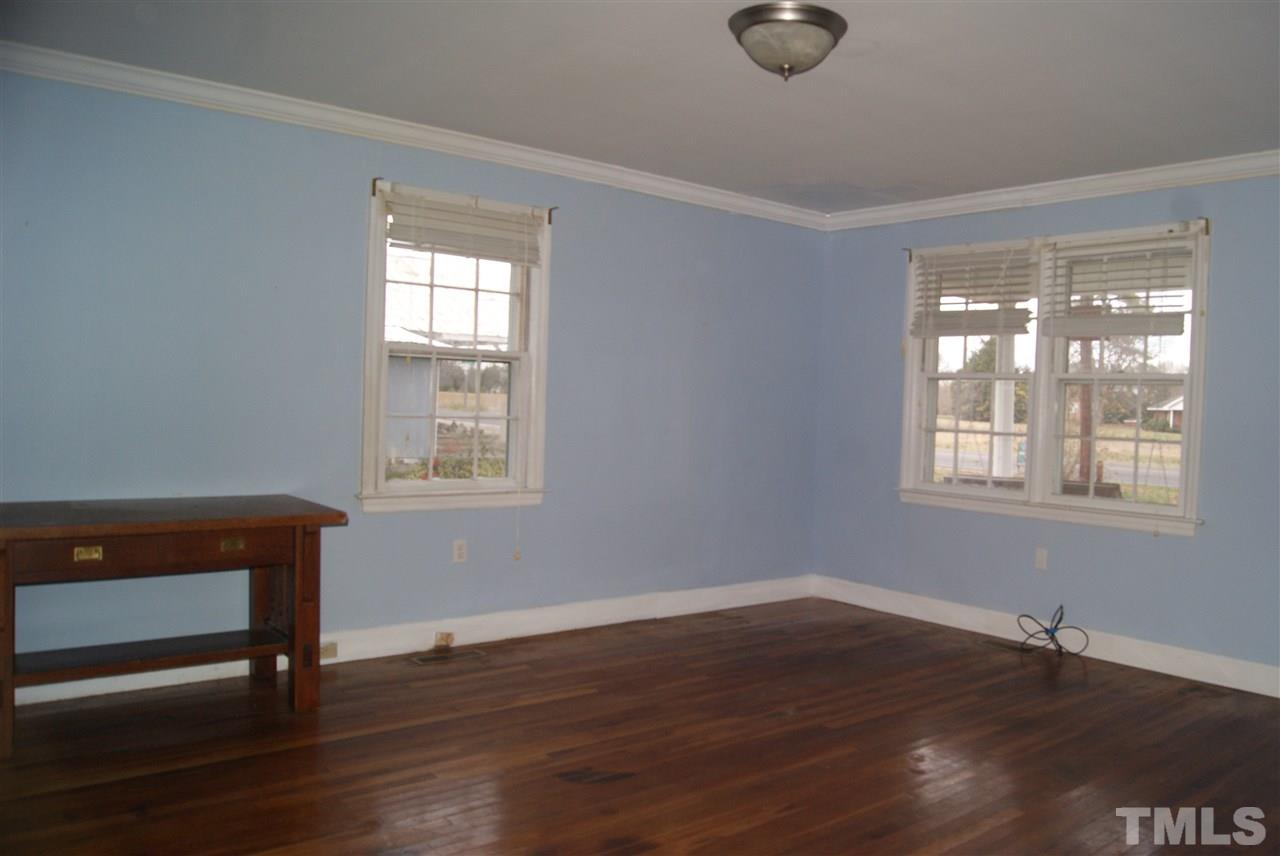 9716 Sauls Road Raleigh, NC 27603 - Photo 14 of 23 a room with wooden floor and windows