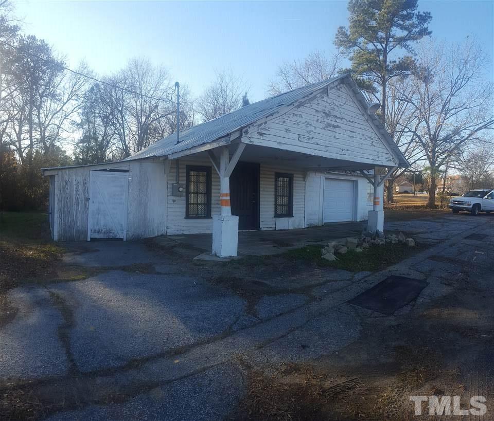 9716 Sauls Road Raleigh, NC 27603 - Photo 3 of 23 a view of a house with yard and tree s