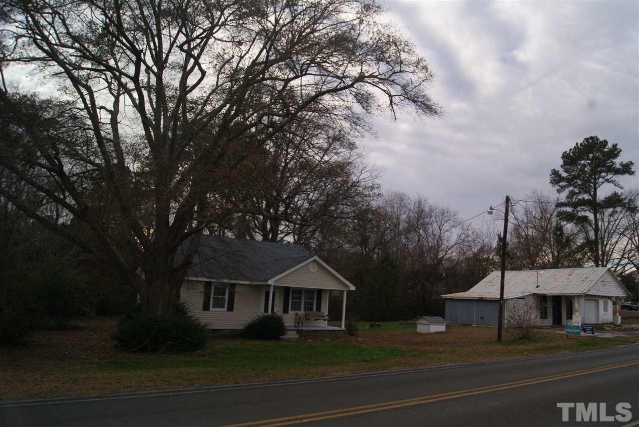 9716 Sauls Road Raleigh, NC 27603 - Photo 5 of 23 a front view of a house with a garden