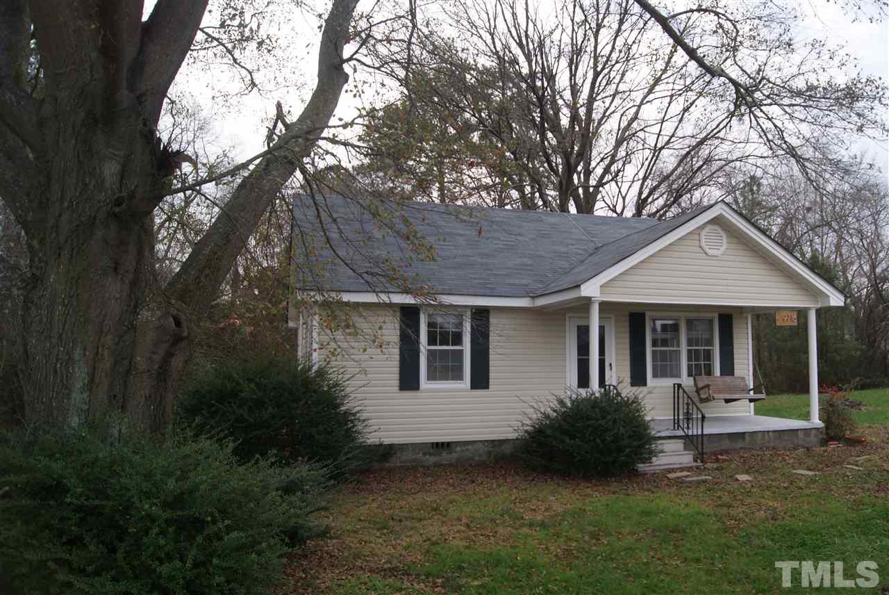 9716 Sauls Road Raleigh, NC 27603 - Photo 6 of 23 a view of a house with backyard and garden