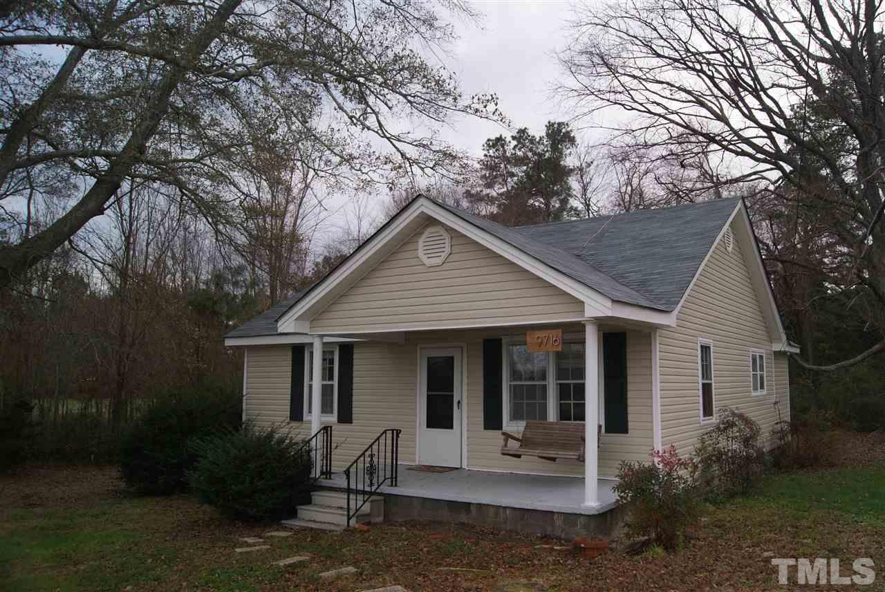 9716 Sauls Road Raleigh, NC 27603 - Photo 7 of 23 a view of a house with a yard next to a yard