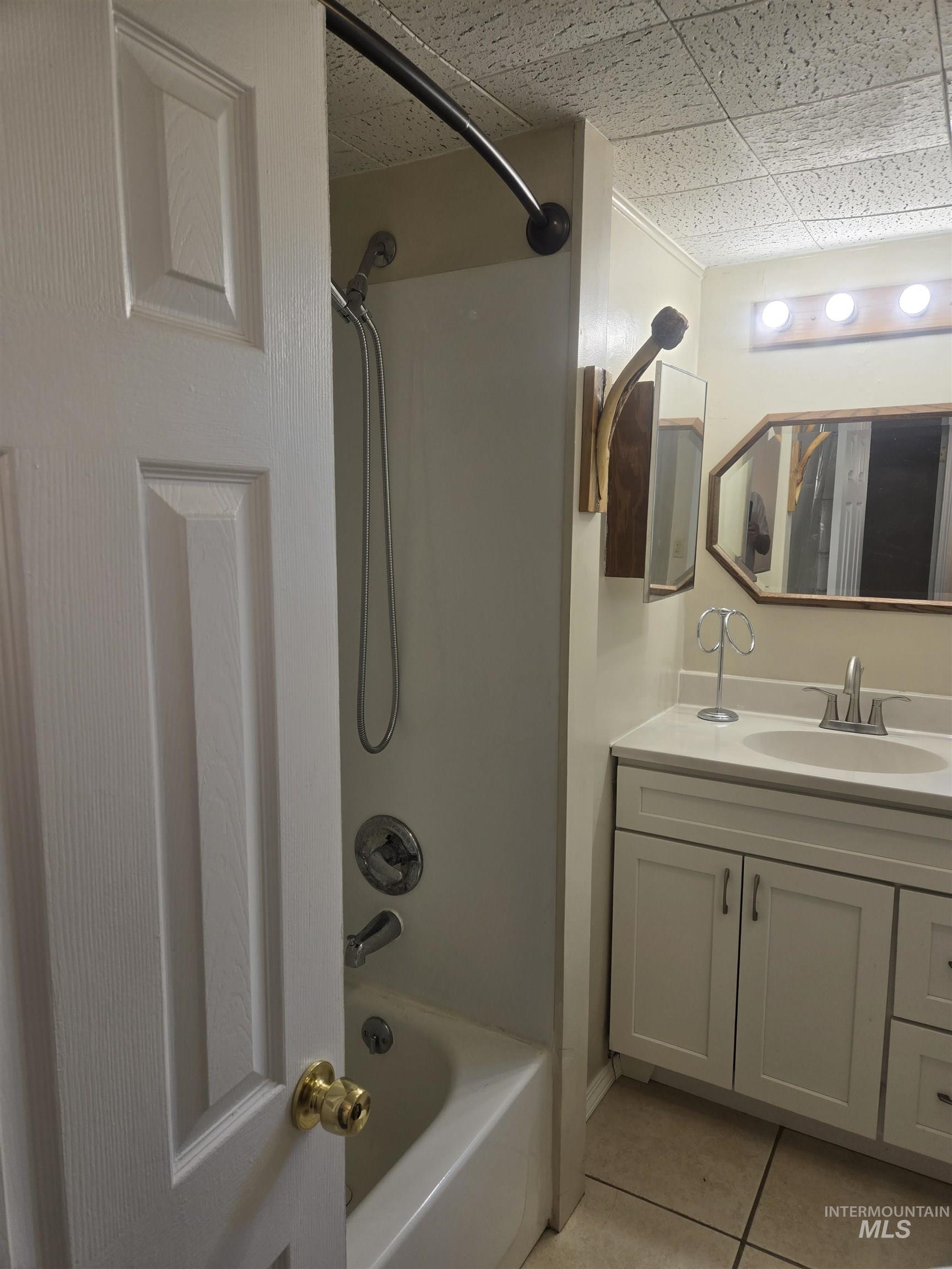 4099 Lakeview Road Orofino, ID 83544 - Photo 12 of 41 Bathroom featuring a white vanity with cabinet storage, integrated sink, chrome faucet, and overhead lighting