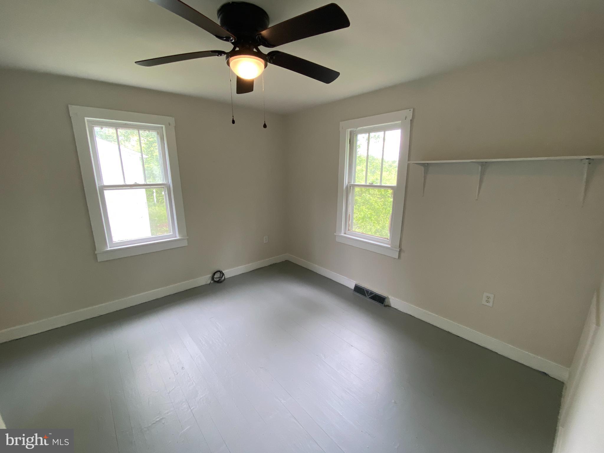 9067 St Anthonys Road King George, VA 22485 - Photo 9 of 24 a view of an empty room with a window