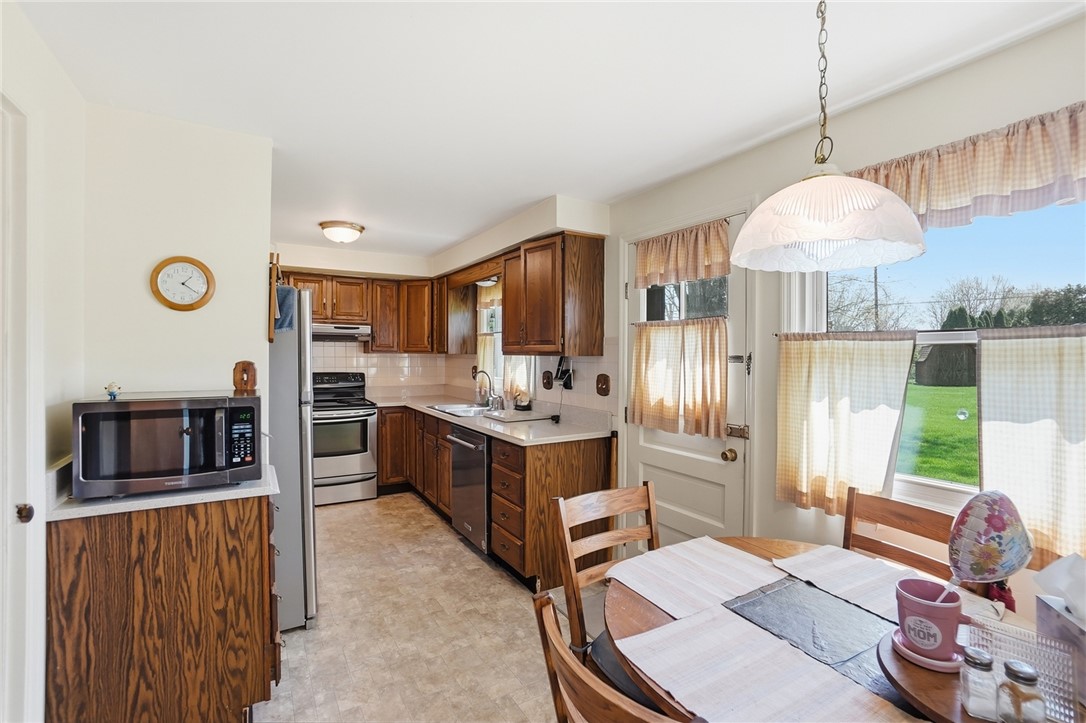 6225 Possum Run Road Bellbrook, OH 45305 - Photo 10 of 33 This bright kitchen features ample cabinetry and a functional layout, ideal for daily living and entertaining.