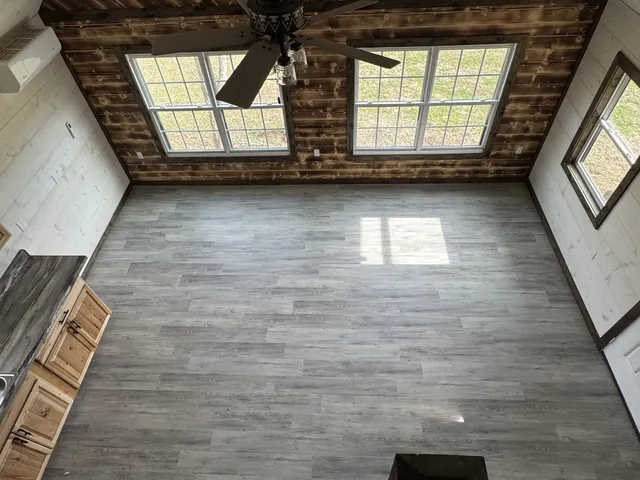 a view of an empty room with a window