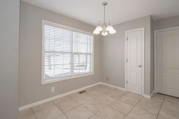 a kitchen with stainless steel appliances granite countertop a refrigerator a sink and dishwasher