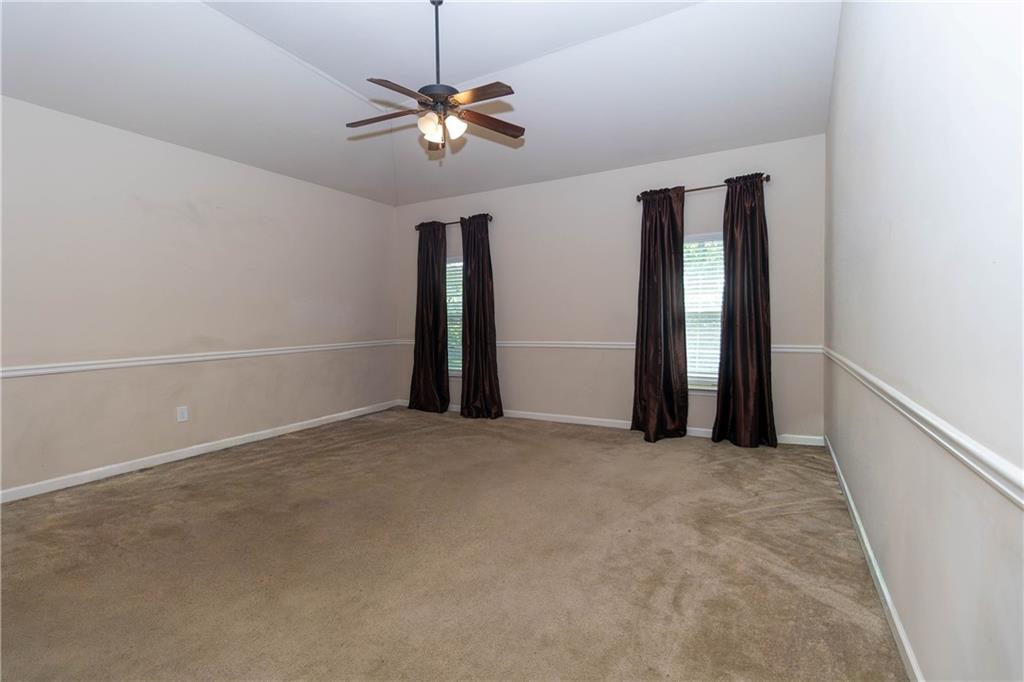 70 Sylvan Loop Fayetteville, GA 30214 - Photo 28 of 40 a view of an empty room with a chandelier fan