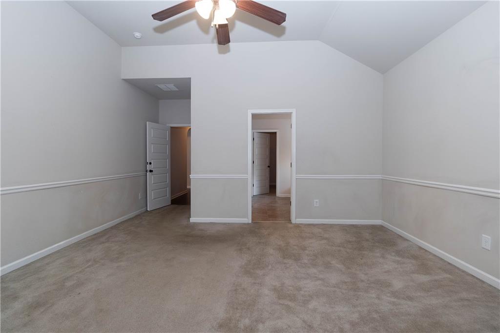 70 Sylvan Loop Fayetteville, GA 30214 - Photo 29 of 40 an empty room with chandelier fan