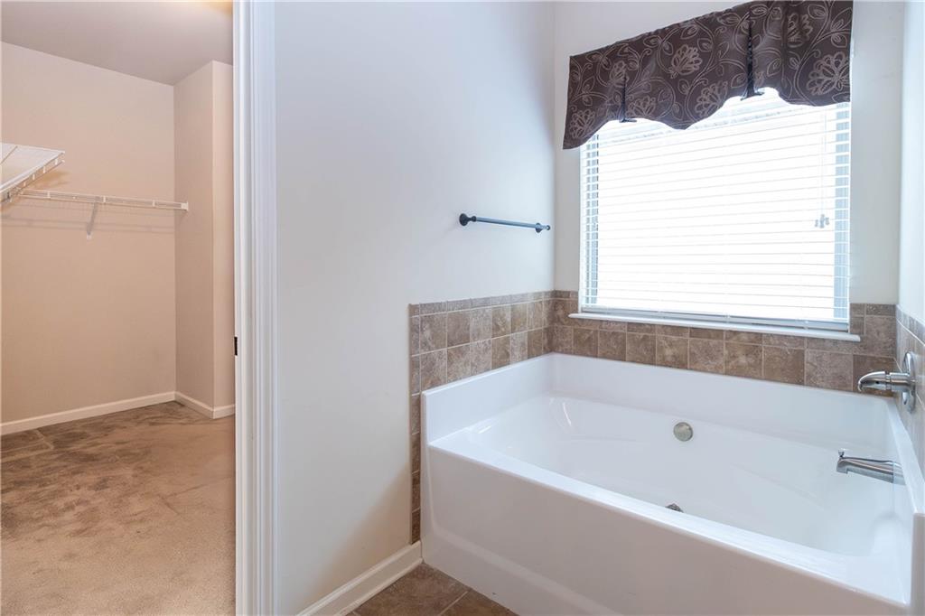 70 Sylvan Loop Fayetteville, GA 30214 - Photo 31 of 40 a white bath tub sitting next to a window